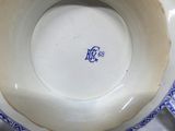 a blue and white plate that has a blue and white design on it