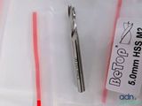 a pair of scissors sitting next to a plastic bag