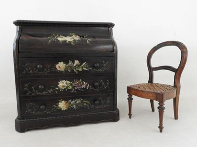 a small wooden chair next to a small chest of drawers