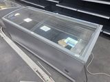 a glass display case in the middle of a store