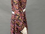 an image of a mannequin wearing a dress and hat