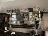 a bar with a lot of glasses on top of it
