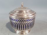 an antique silver and blue glass covered bowl with a lid