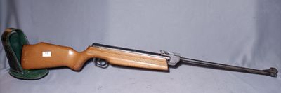 an image of a toy gun with a wooden handle on a white background