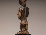 an image of a statue of a man holding a baby