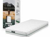 le matelas Green Moon dans sa boîte, à côté de son emballage