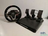 steering wheel and pedals for a racing car on a table