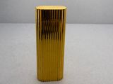 a gold vase that is sitting on a table