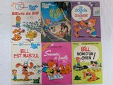quatre livres pour enfants sont alignés sur une surface blanche