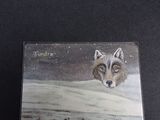 a picture of a card with a picture of a wolf in the snow