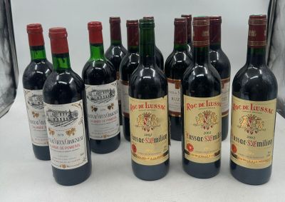 several bottles of wine are lined up on a table