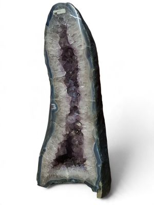 a close up of a large piece of amethorate on a white background