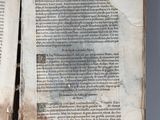 an open book with a page of text on it sitting on top of a table