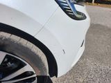 a close up view of a car ' s front wheel and tire