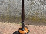 a small table with a wooden top on a sidewalk