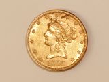 an image of a gold coin with a woman ' s head on it