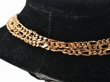 a close up of a necklace on a mannequin mannequin