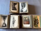 several old photos of people are in a box on a table