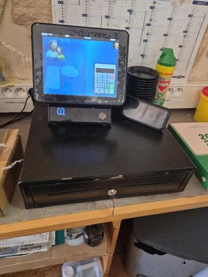 a laptop computer sitting on top of a desk