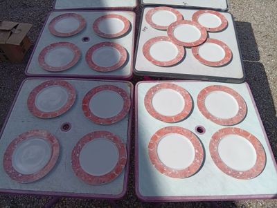 many plates and pans sitting on a table