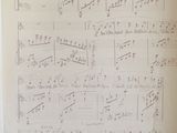 an old sheet of music with notes written on it