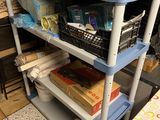 a blue cart with baskets on top of it in a kitchen