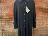 the coat is black and has a white tag on it