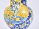 a yellow vase with a blue and yellow design on it