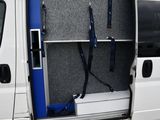 a white van with a flat screen tv in the back of it