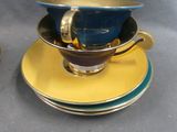 two cups and saucers sitting on top of each other