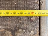 a measuring tape that is on the side of a sidewalk