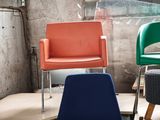many chairs and tables in a room with a window