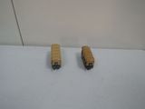 two toy buses that are sitting on a table