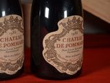 two bottles of wine that are sitting on a table