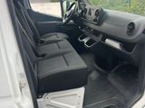 the interior of a white van with the door open