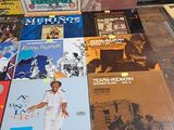 a lot of records on a table in a room