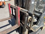 a forklift that is parked in a parking lot