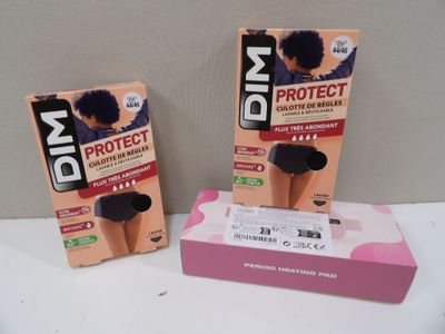 two boxes of hair products sitting on a table next to each other