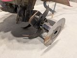 a close up of a tractor that is parked in a garage