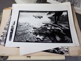a lot of black and white photos on a table