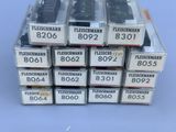 a stack of boxes with remote controls on top of each other