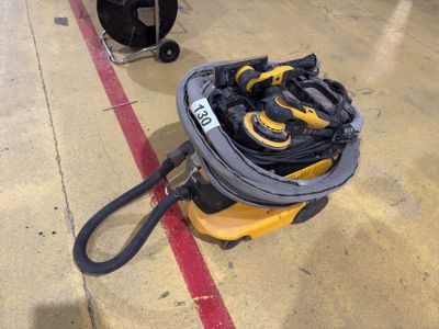 a yellow and black bag of tools on the floor