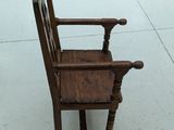 a wooden chair that is sitting in a room