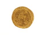 l'image d'une pièce d'or sur laquelle figure l'image d'un homme