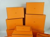several orange boxes stacked on top of each other on a table