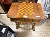 a wooden table with a chess board on it