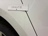 a white car with a ruler on the side of it