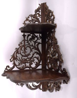 a wooden shelf that has a shelf on top of it