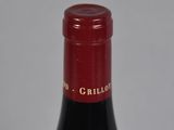 a bottle of wine that is sitting on a table