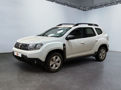 the white dacia is parked inside of a white room